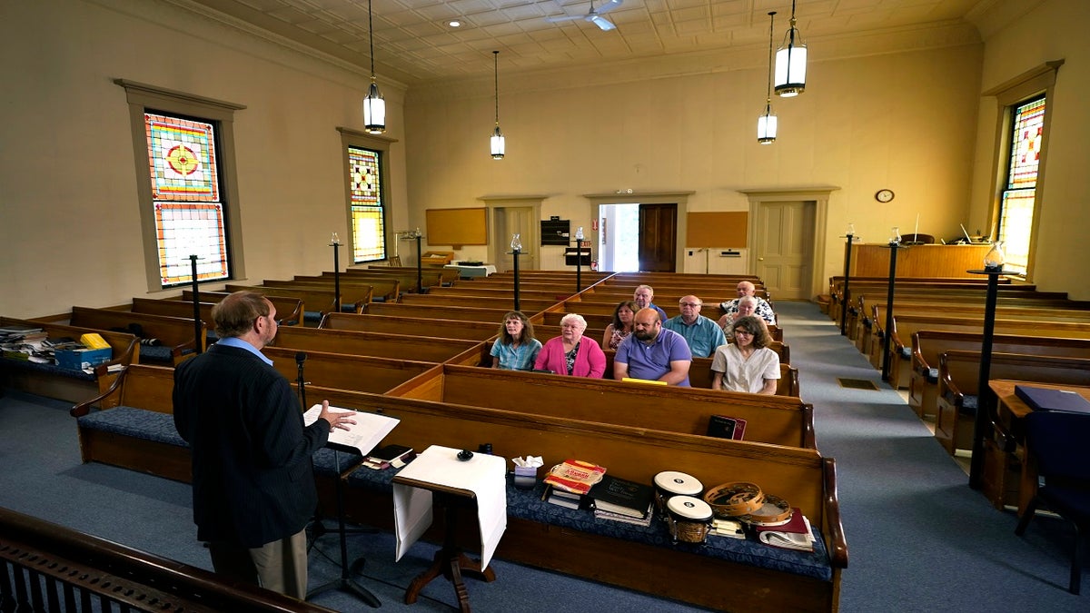 Minister Greg Foster delivers a sermon at Waldoboro United Methodist Church, Sunday, June 20, 2021, in Waldoboro, Maine. The deepening slide in attendance at the Waldoboro church forced its closure. The last sermon was on June 27. (AP Photo/Robert F. Bukaty)