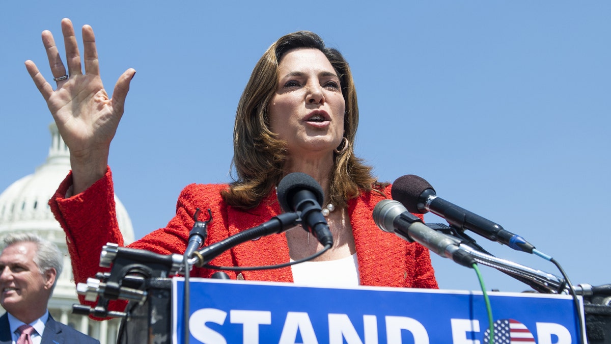 Rep. Maria Elvira Salazar, R-Fla., speaks during a news conference to highlight Cuban Independence Day outside the Capitol on Thursday, May 20, 2021. Rep. Mario Diaz-Balart, R-Fla., left, and House Minority Leader Kevin McCarthy, R-Calif., also appear. 