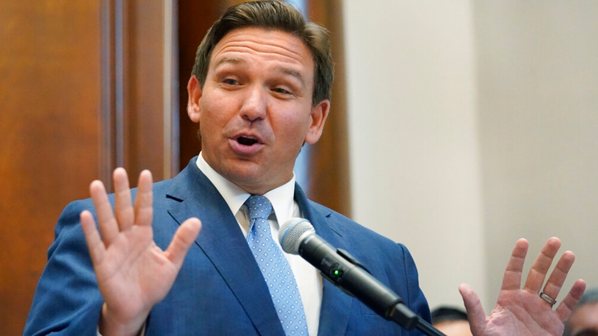 Florida Gov. Ron DeSantis gestures as he speaks, Monday, June 14, 2021, at the Shul of Bal Harbour, a Jewish community center in Surfside, Fla. 