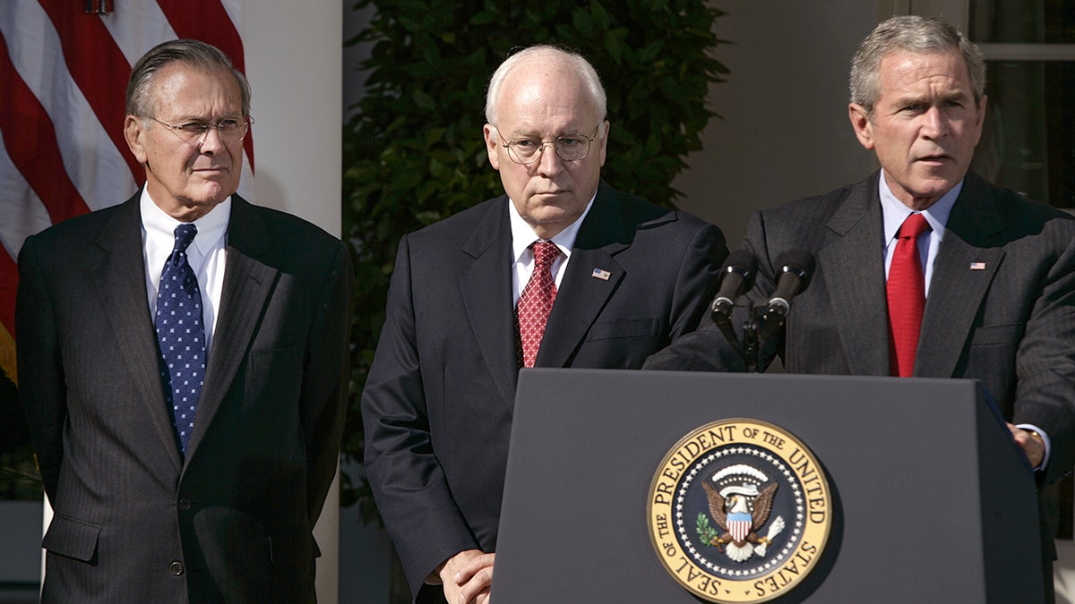 President Bush, along with Secretary of Defense Donald H. Rumsfeld (left) and Vice President Dick Cheney, deliver a statement on the war on terror at the White House on September 28, 2005.