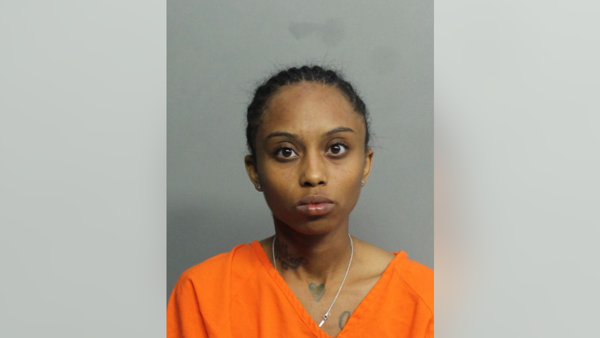 Taniyria Holt, 24, is accused of accidentally shooting her teenage sister in the head while riding in a car Sunday night. 