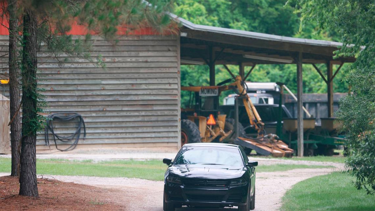 A vehicle sits in the driveway of the Murdaugh family's home, Tuesday, June 8, 2021, in rural Colleton County, near Islandton, S.C.