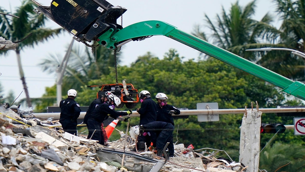 Crews work in the rubble of Champlain Towers South residential condo on Tuesday. (AP)