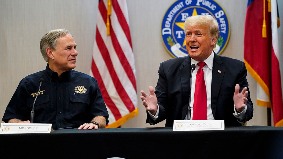 Texas Gov. Greg Abbott and former President Donald Trump attend a briefing with state officials and law enforcement at the Weslaco Department of Public Safety DPS Headquarters before touring the US-Mexico border wall on Wednesday, June 30, 2021 in Weslaco, Texas.