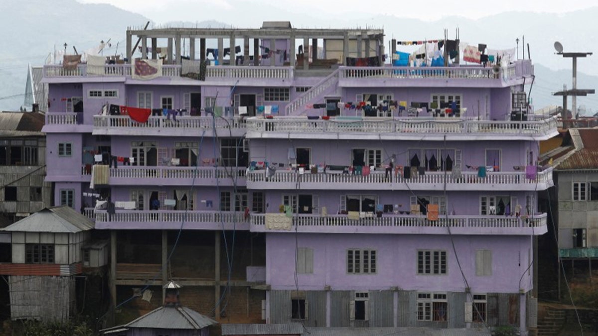 FILE PHOTO: A view of Ziona's 4 storey house in Baktawng village in the northeastern Indian state of Mizoram, October 6, 2011. REUTERS/Adnan Abidi