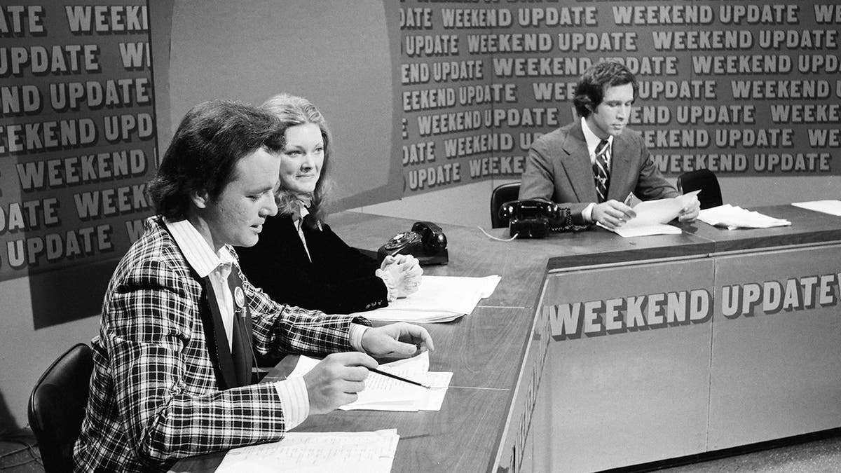 SATURDAY NIGHT LIVE -- Episode 11 -- Pictured: (l-r) Bill Murray, Jane Curtin, Chevy Chase during 'Weekend Update' on February 18, 1978.?