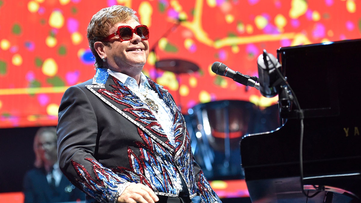 Elton John sings on stage