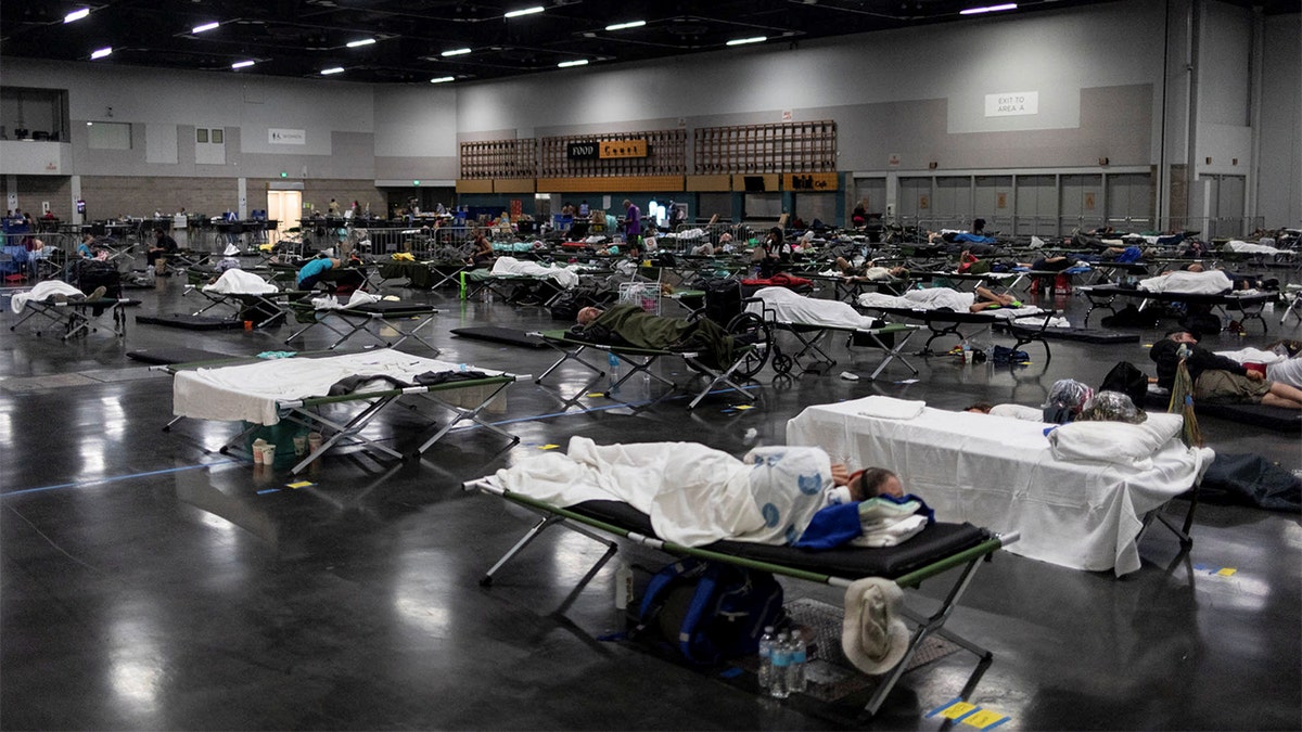 People sleep at a cooling shelter set up during an unprecedented heat wave in Portland, Oregon, U.S. June 27, 2021. (REUTERS/Maranie Staab)