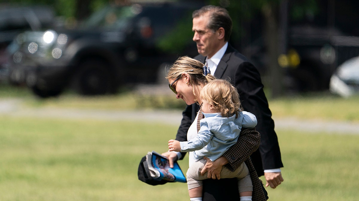 Hunter Biden, Melissa Cohen and baby Beau Biden walk to Marine One upon departure from the White House, May 22, 2021, in Washington. (AP File Photo/Alex Brandon)