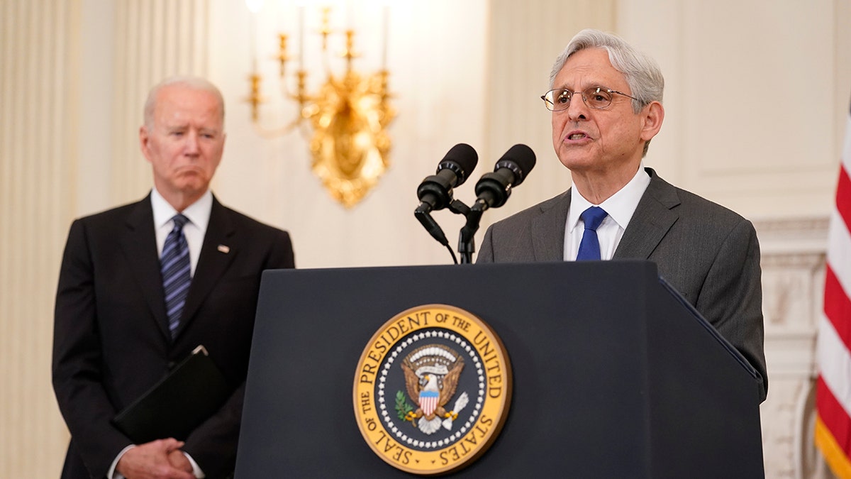 President Joe Biden, left, listens as Attorney General Merrick Garland speaks at the White House on June 23, 2021.