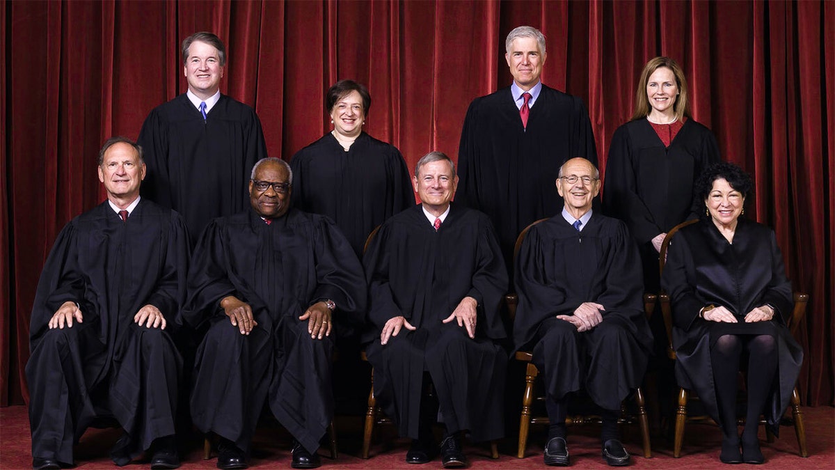 FILE - In this April 23, 2021, file photo members of the Supreme Court pose for a group photo at the Supreme Court in Washington. Seated from left are Associate Justice Samuel Alito, Associate Justice Clarence Thomas, Chief Justice John Roberts, Associate Justice Stephen Breyer and Associate Justice Sonia Sotomayor, Standing from left are Associate Justice Brett Kavanaugh, Associate Justice Elena Kagan, Associate Justice Neil Gorsuch and Associate Justice Amy Coney Barrett. (Erin Schaff/The New York Times via AP, Pool, File