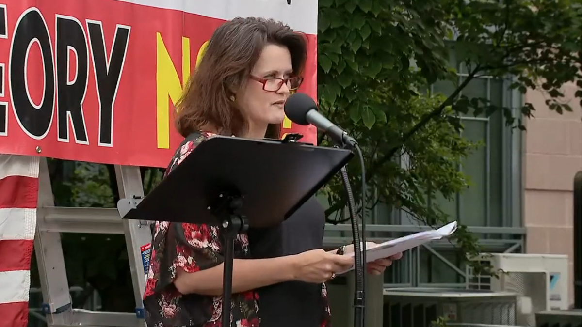 Monica Gill, a high school teacher, was among those to speak at the "Education, Not Indoctrination" rally Saturday.