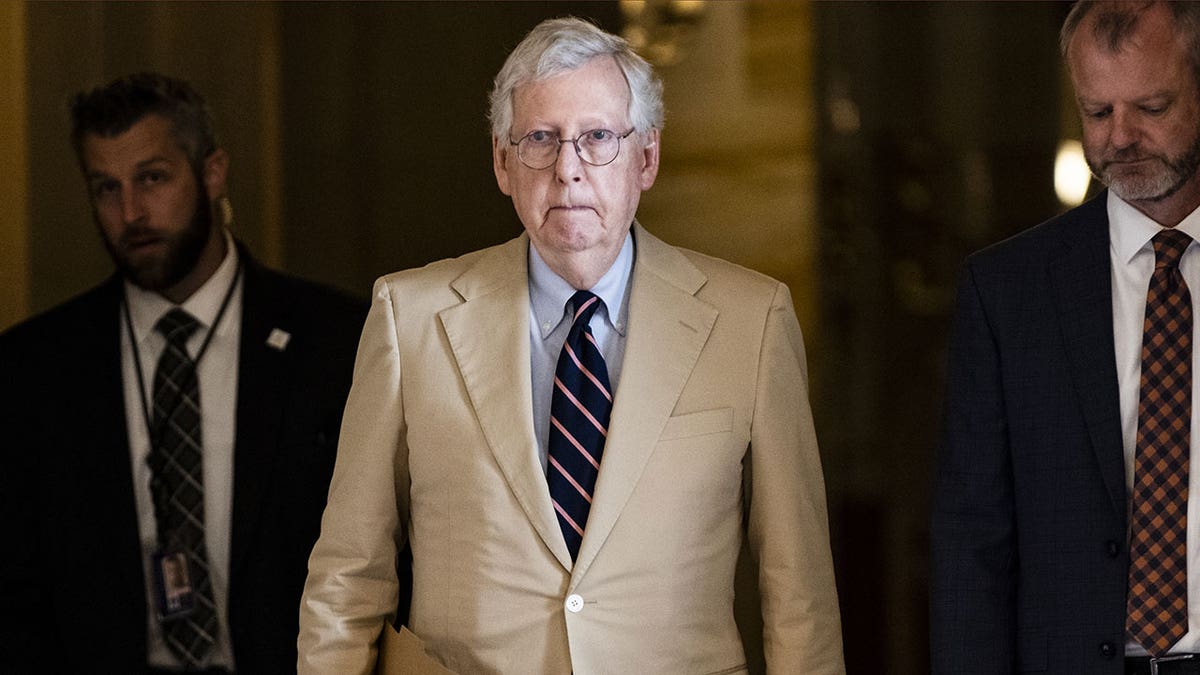 Mitch McConnell walks through Senate