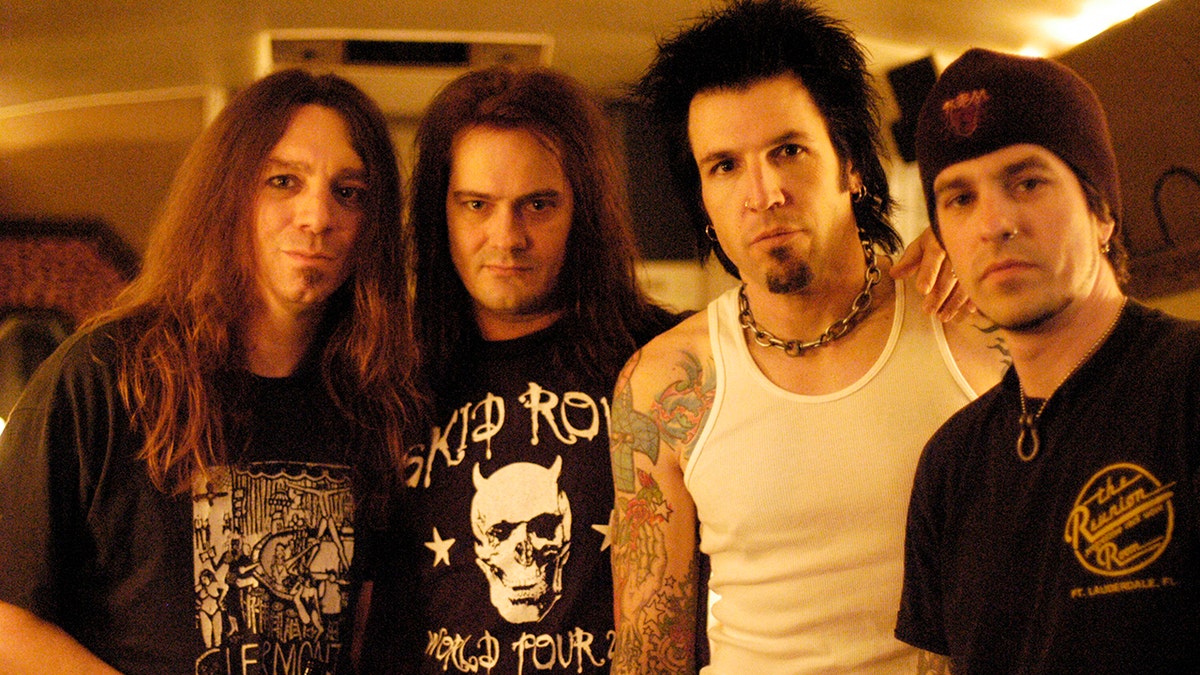 Rock band Skid Row (L-R) Scott Hill, Johnny Solinger, Phil Varone, Rachel Bolan pose for a portrait at the Whisky a Go Go  in Los Angeles, California on March 10, 2004.