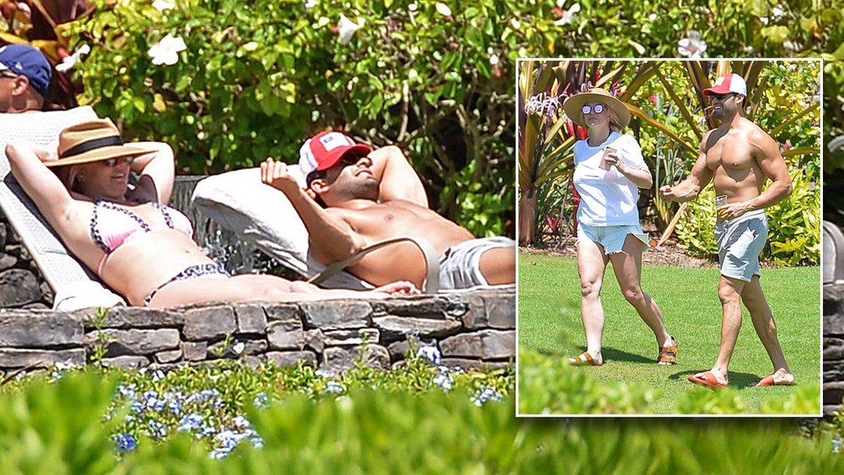 Britney Spears was spotted sunbathing in Hawaii with longtime boyfriend Sam Asghari.