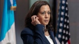 Vice President Kamala Harris removes her translation device during a news conference with Guatemalan President Alejandro Giammattei, Monday, June 7, 2021, at the National Palace in Guatemala City. (AP Photo/Jacquelyn Martin)
