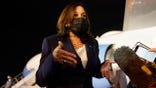 Vice President Kamala Harris talks to the press gathered under the wing of Air Force Two as she prepares to depart for Mexico, from Guatemala's Air Force Central Command, Monday, June 7, 2021. (AP Photo/Jacquelyn Martin)