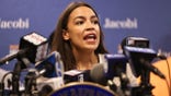 NEW YORK, NEW YORK - JUNE 03: Rep. Alexandria Ocasio-Cortez (D-NY) speaks during a press conference at Jacobi Hospital in the Morris Park neighborhood on June 03, 2021 in the Bronx borough of New York City. Senate Majority Leader Chuck Schumer (D-NY), joined by Rep. Alexandria Ocasio-Cortez (D-NY) and Rep. Jamaal Bowman (D-NY), held a press conference urging Congress to provide $400,000 to Jacobi Hospital's Stand Up to Violence (SUV) Program, a youth violence reduction program, on the heels of a Memorial Day weekend that saw a total of nine shootings across NYC. One of the victims was a 15-year old Bronx resident. The program is modeled after Chicago's Cure Violence program that responds to shootings to help prevent retaliation and to assists family members of those who have been injured or killed. The money would allow Stand Up to Violence (SUV) Program to add an emergency room social worker, case worker, part time psychiatrist and a creative arts or music therapist.  (Photo by Michael M. Santiago/Getty Images)