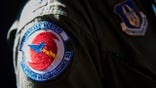 The pilots patch on his flight suit within a C-130 belonging to the US Air Force 53rd Weather Reconnaissance Squadron (AFRC) "Hurricane Hunters" during the 2017 National Oceanic and Atmospheric Administration (NOAA) Hurricane Awareness Tour at Ronald Reagan Washington National Airport in Arlington, Virginia, on May 9, 2017. / AFP PHOTO / JIM WATSON        (Photo credit should read JIM WATSON/AFP via Getty Images)