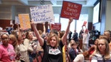 A Virginia School board meeting reflects a battle playing out across the country over a once-obscure academic doctrine known as Critical Race Theory, in Ashburn