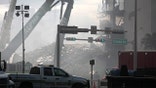 Construction equipment is used to remove rubble at the site of a collapsed building in Surfside, Florida, north of Miami Beach,on June 26, 2021. - An engineer warned of "major structural damage" at a Florida apartment building three years before it partially collapsed, a report said June 26, as rescuers raced to find 159 people still unaccounted for in the mountain of debris. Four people have been confirmed dead after the 12-story oceanfront building in Surfside pancaked as residents slept inside in the early hours of June 24. (Photo by Andrea SARCOS / AFP) (Photo by ANDREA SARCOS/AFP via Getty Images)