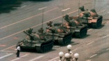 In this June 5, 1989, file photo, a man stands alone in front of a line of tanks heading east on Beijings Changan Blvd. in Tiananmen Square, Beijing. Hong Kong’s second ban on an annual vigil for victims of the bloody June 4, 1989, crackdown on Beijing’s Tiananmen Square protest movement and the closure of a museum dedicated to the event may be a further sign that the ruling Communist Party is extending its efforts to erase the event from the collective consciousness from the mainland to Hong Kong. (AP Photo/Jeff Widener, File)