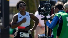 Old Gwen Berry photo of her holding American flag goes viral amid anthem uproar