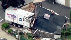 Boston-area man plows stolen truck into house, guns down 2 people before being shot dead by police
