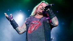 Mötley Crüe singer Vince Neil transported to hospital after falling off stage during concert: report