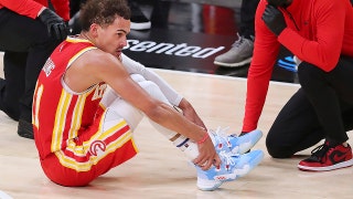 Hawks' Trae Young injures ankle after stepping on ref's foot in 'freaky accident'