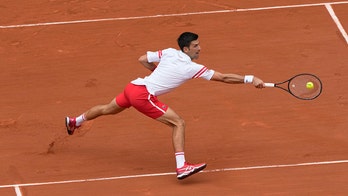 Djokovic recovers from 2-set French Open hole against teen