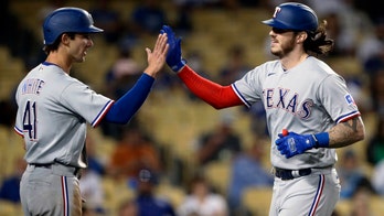 Rangers snap 16-game road losing streak, rout Dodgers 12-1