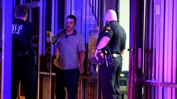 Gun battle at Dallas strip mall leaves 8 injured, including 2 kids, police say