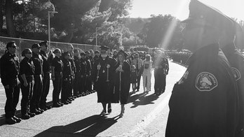 Slain California firefighter's daughter wears his jacket at graduation