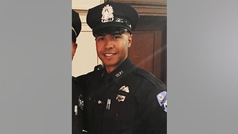 Massachusetts police officer dies after trying to save drowning teen