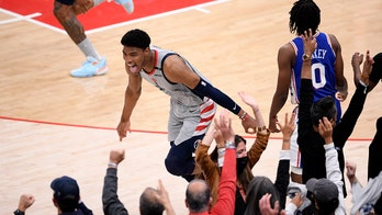 Embiid leaves with sore knee, 76ers lose to Wizards 122-114