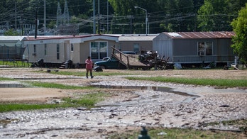 Claudette heads out to sea after causing 14 deaths