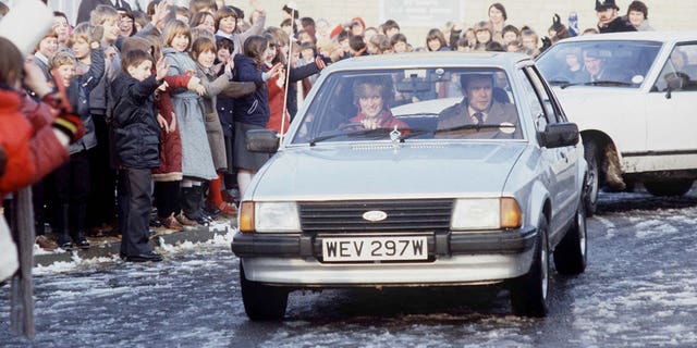 Diana Driving her car to a school visit with police bodyguard Graham Smith.