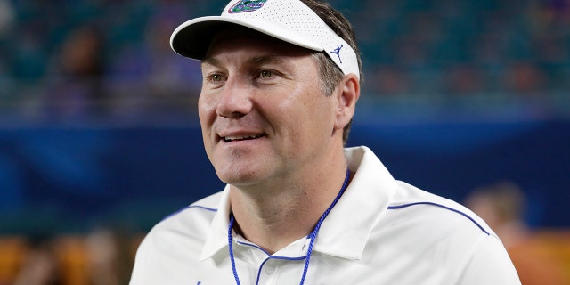 FILE - Florida head coach Dan Mullen walks on the field before the Orange Bowl NCAA college football game against Virginia in Miami Gardens, Fla., in this Monday, Dec. 30, 2019, file photo.