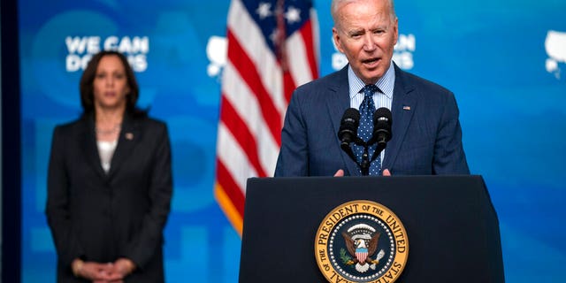 Vice President Kamala Harris listens as President Joe Biden speaks about the COVID-19 vaccination program, in the South Court Auditorium on the White House campus, Wednesday, June 2, 2021, in Washington. (AP Photo/Evan Vucci)