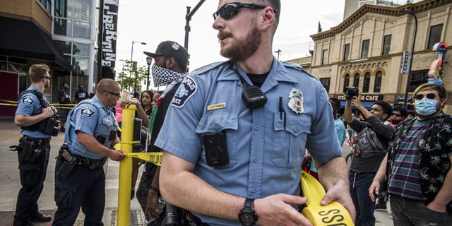 Police investigate a shooting as protesters gather on Thursday, June 3, 2021 in Minneapolis.