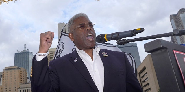 FILE - In this Nov. 14, 2020 file photo, Texas GOP chairman Allen West, right, speaks to supporters of President Donald Trump during a rally in front of City Hall in Dallas. West announced Friday, June 4, 2021, he was stepping down less than a year into a combative tenure of challenging his own party's top leaders, including leading a protest outside Republican Gov. Greg Abbott's mansion. (AP Photo/LM Otero File)