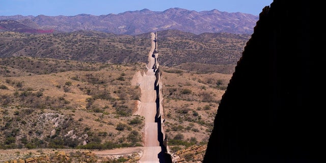 A new border wall stretches along the landscape near Sasabe, Arizona.