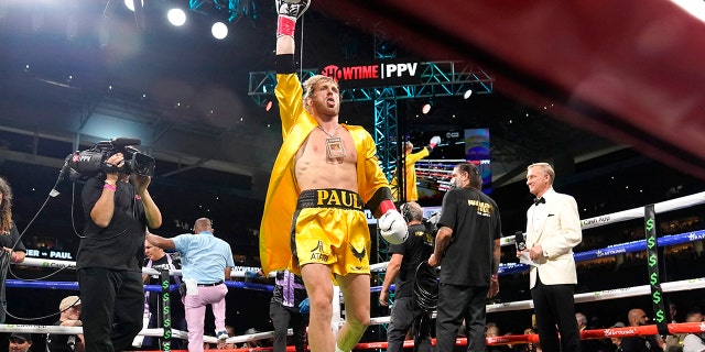 Logan Paul walks into the ring for an exhibition boxing match against Floyd Mayweather at Hard Rock Stadium, Sunday, June 6, 2021, in Miami Gardens, Fla.