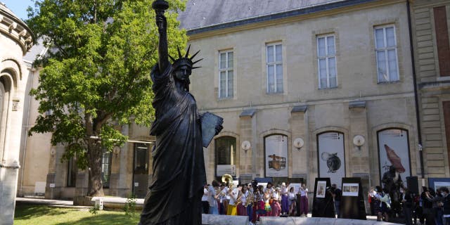 Lady Liberty has a "little sister" and she’s on her way to the U.S. from France for a limited time. (AP Photo/Francois Mori)