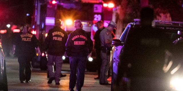 In this Monday, Jan. 28, 2019, file photo, police investigate the scene where several Houston Police officers were shot in Houston.