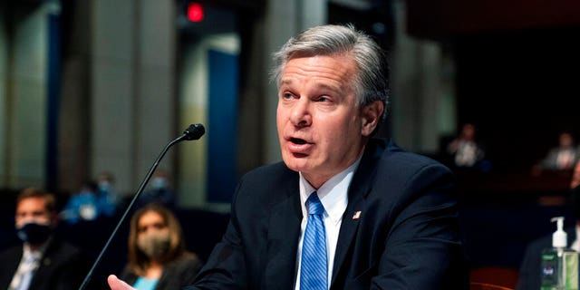FBI Director Wray photographed testifying during House hearing