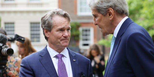 CEO of Bank of America, Brian Moynihan, left, speaks with John Kerry, the US Special Presidential Envoy for Climate, during a sustainability and G7 engagement event for Terra Carta Transition Coalitions, an organized, global collective working together to drive investment towards a sustainable future for Nature, People and Planet, at St James's Palace in London, Thursday, June 10, 2021. (Chris Jackson/Pool Photo via AP)