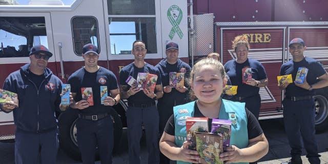 The Girl Scouts of New Mexico Trails shows donated cookies to firefighters in Rio Rancho, New Mexico, as part of their Hometown Heroes program. During the coronavirus pandemic, many Girl Scout troops nixed traditional cookie booths for safety reasons, which left millions of boxes unsold. (Girl Scouts of New Mexico Trails via AP)
