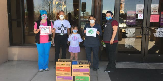 The Girl Scouts of New Mexico Trails visited health care workers at Christus St. Vincent Health System in Santa Fe, New Mexico, in April. The troop donated cookies to the health center as part of their Hometown Heroes program. (Girl Scouts of New Mexico Trails via AP)